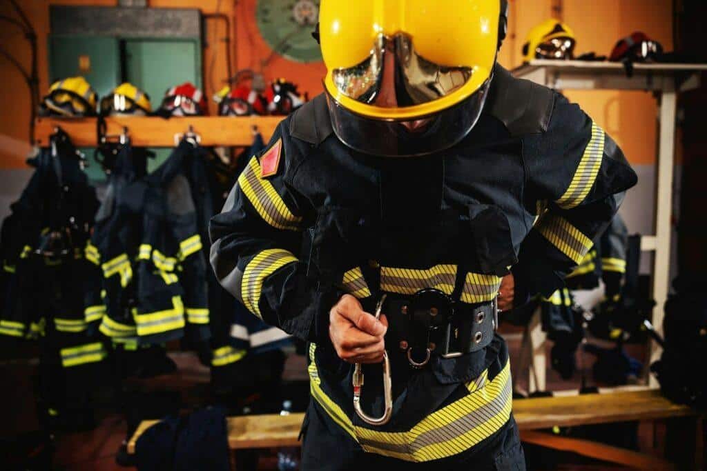 A fire watch firefighter quickly gears up to attend a call out