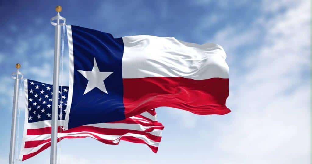 The United States of America and Texas flag flying proudly in the wind